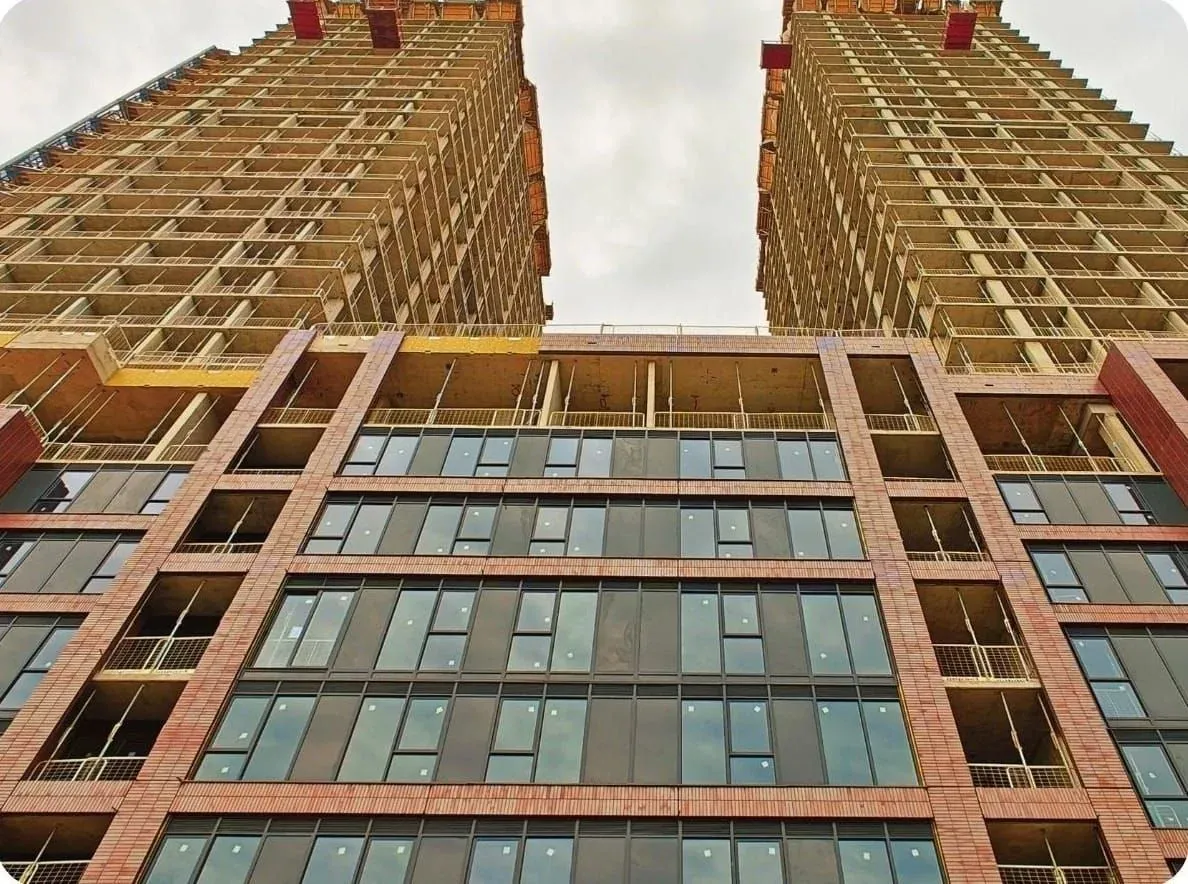 Two precast residential towers under construction at 1141 Bloor Street West