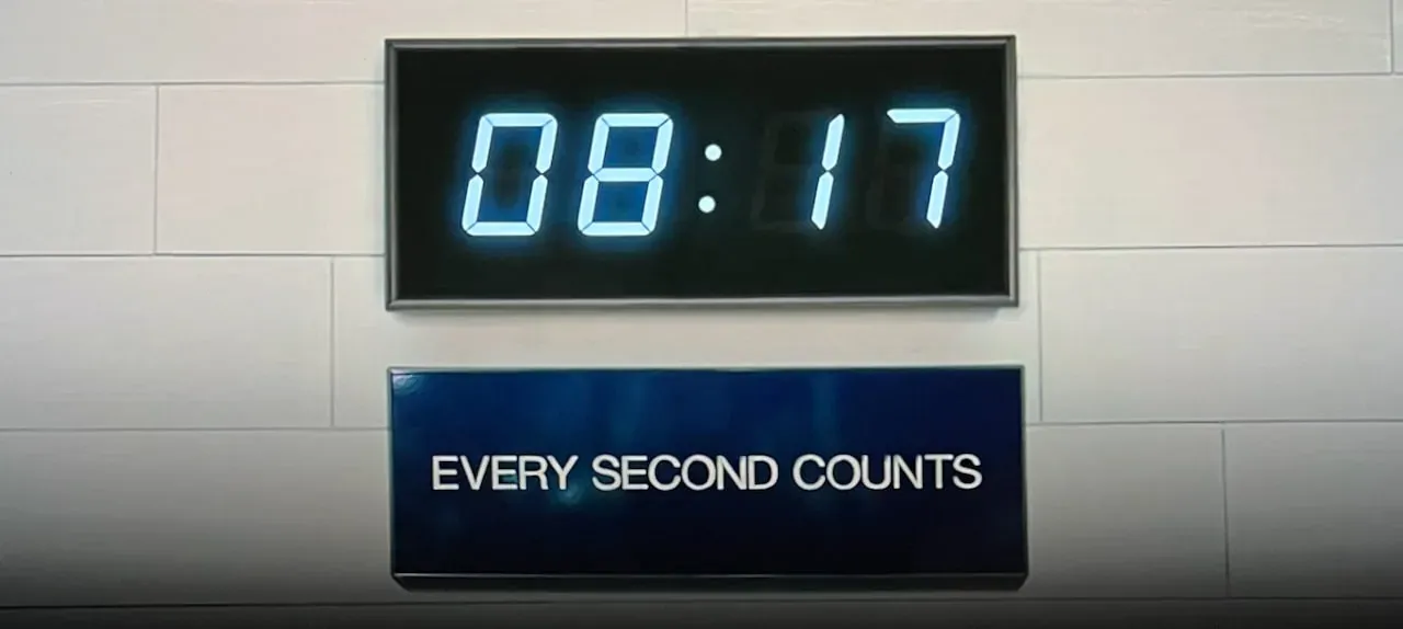 Digital clock at 08:17 above an 'Every Second Counts' sign — construction productivity culture